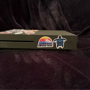 Green Xbox one s Console with Stickers